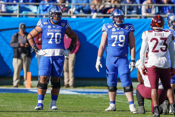 A versatile lineman, Darian Kinnard (left) has the size and strength to be a difference-maker in the NFL.